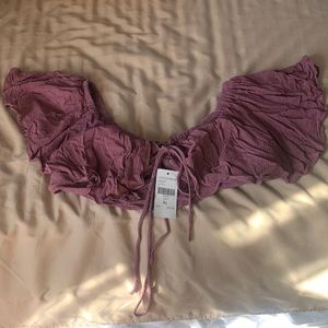 dark mauve color top. Wear it with jeans, shorts and it falls off the shoulder